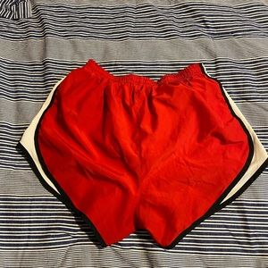 Red Nike running shorts